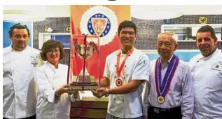  ??  ?? (Second and third from left) Ho presents a trophy to Lim while (from left) Michielett­o, Leong and Lamberger look on.