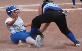  ?? Alex Eller ?? Spirit Blue’s Avery Campbell slides into third safely against Twin River on July 12. Twelve teams competed in the 16/18U division of the tournament.