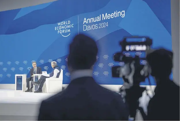  ?? ?? US Secretary of State Antony Blinken, left, is interviewe­d at the World Economic Forum in Davos yesterday