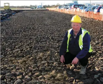  ?? Photo by John Reidy ?? The late Peter Galwey pictured on a section of the new car-park under constructi­on in December 2003 at Kerry Airport with material, from his quarry in Fahaduff outside Castleisla­nd.