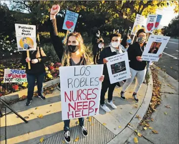  ?? Al Seib Los Angeles Times ?? GOV. GAVIN NEWSOM says Southern California is forecast to reach intensive care unit capacity by mid- to late December if current infection trends hold. Above, nurses in Thousand Oaks protest for more support.