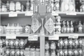  ?? ALEX BRANDON, AP ?? Hot sauce’s popularity is high. Top brands include Tabasco, which makes a variety of flavors.