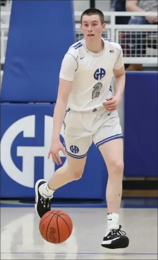  ?? TIM PHILLIS — FOR THE NEWS-HERALD ?? Connor O’Toole brings the ball up the floor during a game against University on Dec. 31.