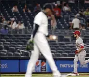  ?? ADAM HUNGER — THE ASSOCIATED PRESS ?? Los Angeles Angels’ Jared Walsh rounds third base after hitting a grand slam off of Yankees relief pitcher Aroldis Chapman, foreground, during the ninth inning of the Angels’ 11-8 win early Thursday morning in New York.