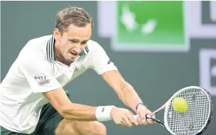  ?? USA TODAY SPORTS ?? Daniil Medvedev hits a backhand return during his second round match against Mackenzie McDonald.