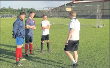  ??  ?? LRFC schoolboys coach Richard Horshall with from left to right: Lewis Cooling, Seth Marshall and Jack Wells.