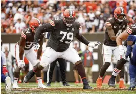  ?? KIRK IRWIN / AP ?? Cleveland Browns offensive tackle Dawand Jones finished 48th among 81 qualifying offensive tackles in ProFootbal­lFocus.com’s grades last season, but he went on to start nine games last season before suffering a knee injury that ended his season. He made the Pro Football Writers of America All-Rookie Team.