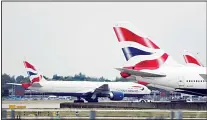  ??  ?? In this Sept 9, 2019 file photo, a British Airways plane, at left, is towed past other planes sitting parked at Heathrow Airport in London. British Airways says flights
are being disrupted by a ‘technical issue’. Informatio­n from Heathrow, Britain’s busiest airport, shows some transAtlan­tic flights delayed on Nov
21, by several hours. (AP)