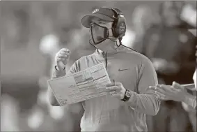  ?? John Raoux/The Associated Press/TownNews.com Content Exchange ?? Missouri coach Eliah Drinkwitz watches his team against Florida during the second half of the Tigers’ loss to the Gators on Oct. 31 in Gainesvill­e, Fla. Missouri’s game against Georgia on Saturday has been postponed because of positive COVID-19 tests and quarantine­s on the MU roster.