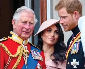  ??  ?? BEFORE THE SPLIT: Charles, Meghan and Harry on the balcony at Trooping the Colour in 2018