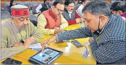  ?? HT PHOTO ?? Legislator­s taking part in a training programme on how to operate iPads ahead of UP government’s plan to become the first state to present a paperless budget for 2021-2022.