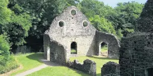  ??  ?? The casting house at Cefn Cribwr Ironworks with the blast furnace to the right which has been damaged by vandals twice in one month