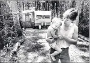 ?? FLORIDA TIMES-UNION FILE ?? In a 1982 file photo, campers Jean Howell and daughter Lynn, 16 months, enjoy Hanna Park. They enjoyed it so much they lived there for more than a year. Time limits were later put in place for campers at the popular park.