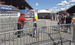  ?? AP ?? A young fan has his temperatur­e checked during a walkthroug­h at the New Hampshire Motor Speedway on Friday in Loudon, N.H., in preparatio­n for Sunday’s Foxwoods 301 NASCAR auto race.