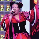  ??  ?? Controvers­ial outfit: Netta on stage EUROVISION winner Netta Barzilai says she wore a kimono-style dress on stage because Korean and Japanese music are big influences on her songwritin­g and she wanted to pay tribute.
‘We thought the K-pop J-pop theme...