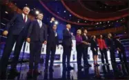  ?? WILFREDO LEE ?? From left, New York City Mayor Bill de Blasio, Rep. Tim Ryan, D-Ohio, former Housing and Urban Developmen­t Secretary Julian Castro, Sen. Cory Booker, D-N.J., Sen. Elizabeth Warren, D-Mass., former Texas Rep. Beto O’Rourke, Sen. Amy Klobuchar, D-Minn., Rep. Tulsi Gabbard, D-Hawaii, Washington Gov. Jay Inslee, and former Maryland Rep. John Delaney pose for a photo on stage before the start of a Democratic primary debate hosted by NBC News at the Adrienne Arsht Center for the Performing Arts, Wednesday, June 26, 2019, in Miami.