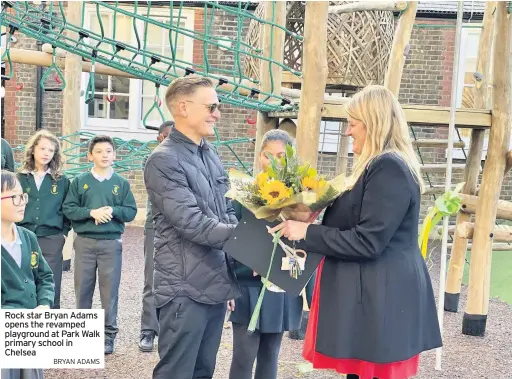  ?? BRYAN ADAMS ?? Rock star Bryan Adams opens the revamped playground at Park Walk primary school in Chelsea