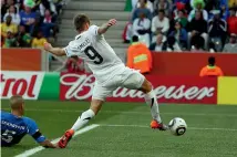  ??  ?? Shane Smeltz scores from close range to give the All Whites a shock 1-0 lead. Smeltz was marginally offside, but Italy had luck on their side with their equaliser.