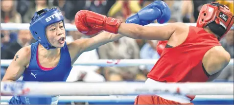  ??  ?? Boxer Mary Kom during her bout against Nikhat Zareen in the 51kg category finals of the women's boxing trials for Olympics 2020 qualifiers, in New Delhi on Saturday, Kom wins 9-1.