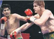  ?? PTI PHOTO ?? Vijender Singh (left), bronze medallist at the Beijing Olympics in 2008, has made a successful foray into profession­al boxing.