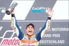  ?? AFP ?? Repsol Honda’s Marc Marquez celebrates on the podium after winning the Grand Prix of Germany at the Sachsenrin­g Circuit on Sunday.