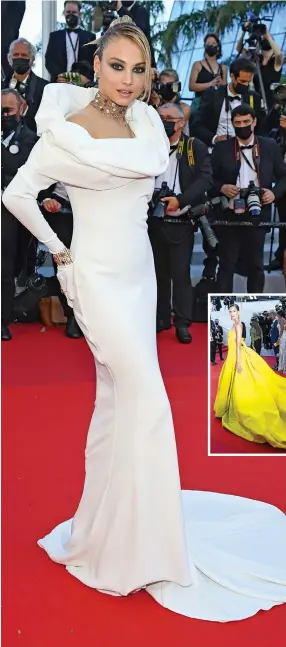  ?? Getty Images
Getty Images ?? Left: Belgian model Rose Bertram showed off a dress by Lebanese designer
Nicolas Jebran.
Above: Saudi designer Mohammed Ashi created this canary yellow number, worn by model Noel Capri Berry.