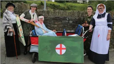  ??  ?? Above: Mary Kelly, Breda Murphy, Bernie O’ Sullivan, Mairead Brosnan, and Margaret Kerins ready to set off on the 1916 Commemorat­ion Parade.