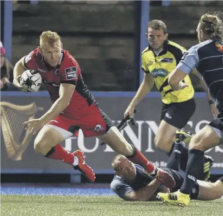  ??  ?? 2 Dan Fish of Cardiff Blues slides in to tackle Edinburgh’s Rory Scholes in Saturday’s first round of Guinness Pro12 games. The visitors must follow this defeat with a tough run of fixtures against Leinster, Munster and Connacht.