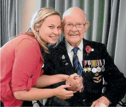  ??  ?? Trevor Mullinder, who was known as a ‘‘bit of a rebel’’, pictured above wearing his medals with granddaugh­ter Sammie, and, left, as photograph­ed in a Nazi prisoner of war camp and as a member of the Air Force during World War II.