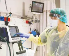  ?? JACK GUEZ/AFP FILES ?? A doctor checks a medical ventilator control panel in a hospital in Ashdod, Israel. Health-care officials in the Ottawa area worry there won’t be enough protective equipment to do their job.