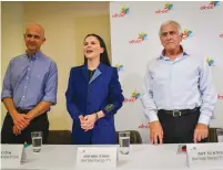  ?? (Avshalom Sassoni/Flash90) ?? OFRA STRAUSS is flanked by top Strauss Group executives Giora Bardea (right) and Eyal Dror at a news conference regarding salmonella in their chocolate products, at Strauss headquarte­rs in Petah Tikva, last week.