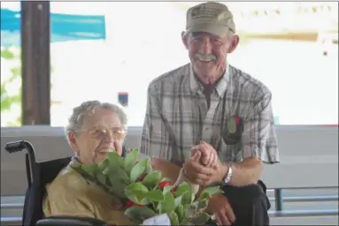  ?? ERIC BONZAR—THE MORNING JOURNAL ?? Edna Halsey, 100, of Wellington ,and Mike Thomas, 75, of Columbia Station, were named the 2016 Lorain County Fair Senior King and Queen, Aug. 25.