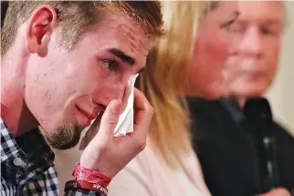 ??  ?? MARJORY STONEMAN Douglas High School student Samuel Zeif cries after his remarks to US President Donald J. Trump during his listening session with school shooting survivors and students at the White House in Washington, Feb. 21.