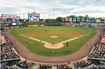  ?? RICK KINTZEL/THE MORNING CALL ?? Lehigh Valley IronPigs fans watch the July 6 game against the Rochester Red Wings at Coca-Cola Park in Allentown.