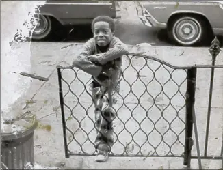  ?? COURTESY OF ERNIE SUGGS ?? Ernie Suggs in front of a Brooklyn brownstone circa 1973, at about age 6. “When I was growing up in Brooklyn in the 1970s, the Afro was always present in my life. All of my cousins had them and so did I.”