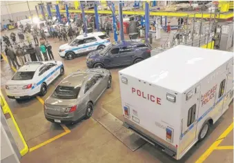  ?? | SUN- TIMES FILE PHOTO ?? An array of police vehicles— many made by Ford— were displayed at the Department of Fleet and Facility Management in 2012 when Mayor Rahm Emanuel announced the purchase of more Ford vehicles by the Chicago Police Department.