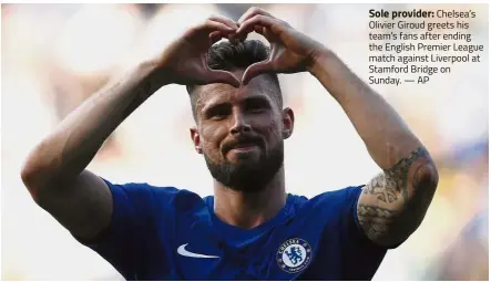  ?? — AP ?? Sole provider: Chelsea’s Olivier Giroud greets his team’s fans after ending the English Premier League match against Liverpool at Stamford Bridge on Sunday.