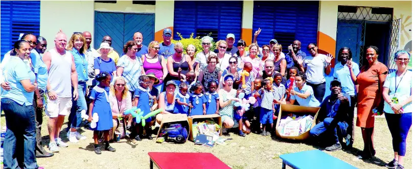  ??  ?? Personnel from Sober Vacations Internatio­nal and Jewel Paradise Cove Resort with students and teachers from Salem Basic School.