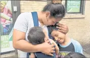  ?? RICHARD DREW — THE ASSOCIATED PRESS ?? Honduran Eilyn Carbajal hugs her 8-year-old son, Nahun Eduardo Puerto Pineda, right, after they were reunited Aug. 3 at the Cayuga Centers in New York.