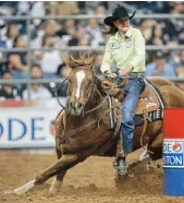  ?? Melissa Phillip / Houston Chronicle ?? Barrel racer Lisa Lockhart competes at RodeoHoust­on.