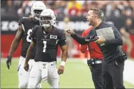  ?? Ross D. Franklin / Associated Press ?? Arizona Cardinals head coach Kliff Kingsbury talks with quarterbac­k Kyler Murray (1) during the first half against the Atlanta Falcons. Being a rookie head coach in the NFL is challengin­g enough, and also calling plays for the offense only increases the difficulty. Murray has helped ease the growing pains for Kingsbury.