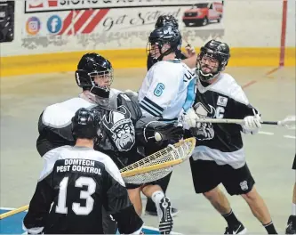  ?? BERND FRANKE THE ST. CATHARINES STANDARD ?? St. Catharines' Alex Simmons (6) is checked in front of the Orangevill­e net in Ontario Junior A Lacrosse League semifinal playoff action Sunday night at Jack Gatecliff Arena in St. Catharines.