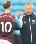  ??  ?? Spoils shared: Chris Wilder with Villa ace Jack Grealish after the game