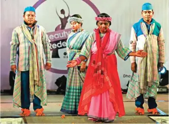  ??  ?? In this photo, Bangladesh­i acid attack survivors walk down the catwalk during the event Beauty Redefined in Dhaka, Bangladesh.