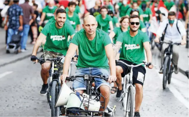  ?? Agence France-presse ?? Protesters ride bicycles during a rally against the climate and energy G20 summit in Naples.the G20 environmen­t, climate and energy ministers meeting starts on Thursday.