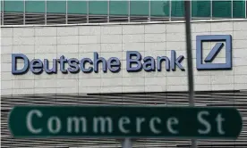  ?? Photograph: Wallace Woon/EPA ?? A Deutsche Bank sign in Singapore’s financial district. The Trump Organizati­on owes the bank around $340m.