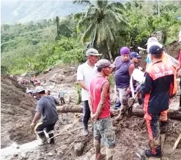  ??  ?? Philippine rescuers used hand tools in a desperate search for around 20 people buried in a landslide unleashed by Typhoon Yutu.