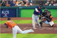  ?? SUE OGROCKI/ASSOCIATED PRESS ?? Rafael Devers of the Red Sox readies to launch a grand slam in the second inning of Boston’s 9-5 victory over the Astros in Houston on Saturday. His homer gave Boston an 8-0 lead.