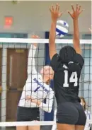  ?? STAFF PHOTO BY MATT HAMILTON ?? GPS volleyball player McKamey Bratcher (1) follows through as East Hamilton’s Morgan Bone defends on Wednesday at GPS, which won 25-11, 25-23, 25-16.