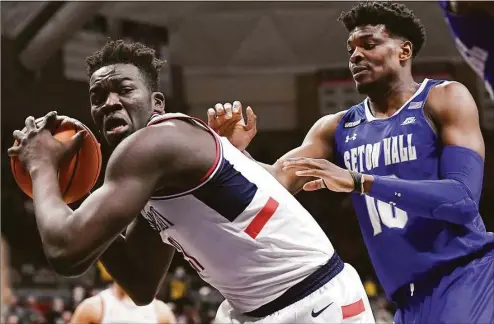  ?? Jessica Hill / Associated Press ?? UConn rising junior center Adama Sanogo, left, is the surest thing the Huskies can bet on this upcoming season.